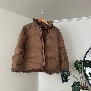 Theory light brown (cocoa powder color). Quality puffer made with down.